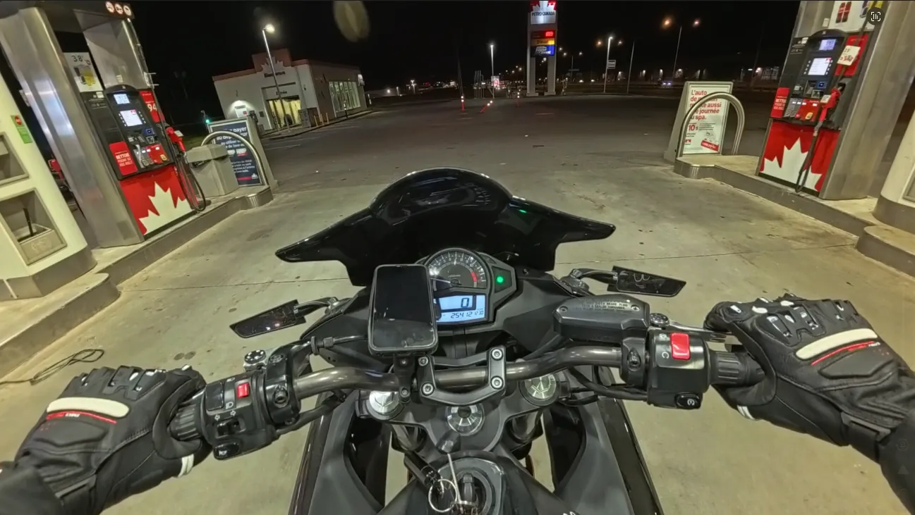 POV shot of the Ninja 650 at a gas station